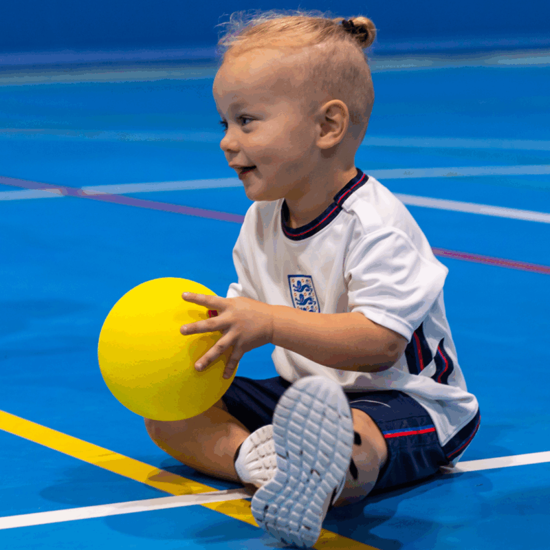 Toddler Movement Classes in Dubai - boy holding a ball